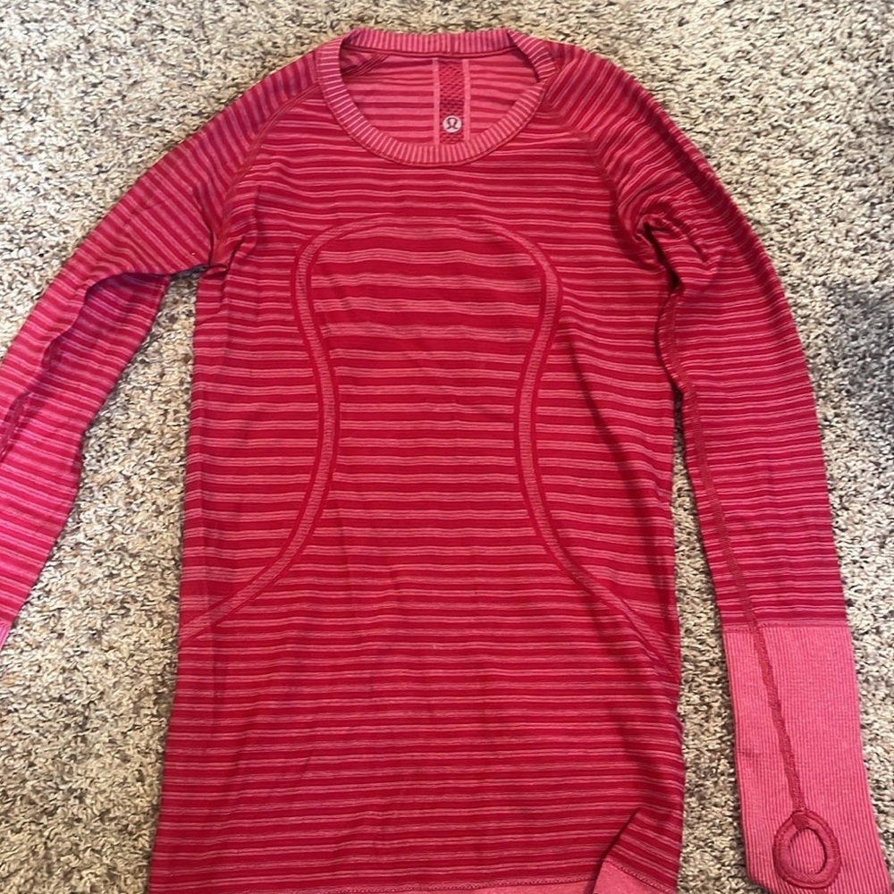 pink lululemon swiftly tech long sleeve. it is a size 2
